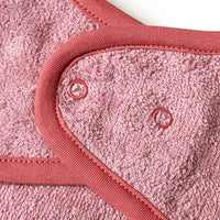 Mouwslabbetje &amp; dinosaurusmotief, roze, 1 stuk